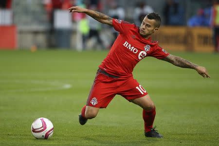 Oct 3, 2015; Toronto, Ontario, CAN; Toronto FC forward Sebastian Giovinco (10) attempts to control the ball against the Philadelphia Union at BMO Field. Toronto FC won 3-1. Mandatory Credit: Tom Szczerbowski-USA TODAY Sports