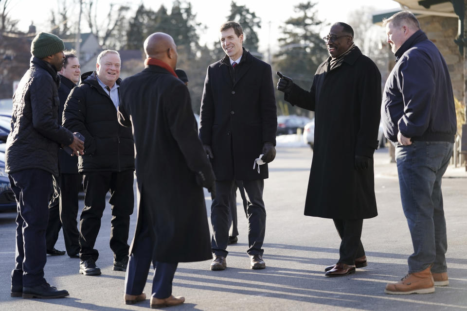 FILE - U.S. Senate candidate U.S. Rep. Conor Lamb, D-Pennsylvania, center, meets with state Rep. Napoleon Nelson, D-Montgomery, center left, state Rep. Dan Williams, D-Chester, center right, and others at a campaign event in Glenside, Pa., Thursday, Jan. 27, 2022. (AP Photo/Matt Rourke, File)