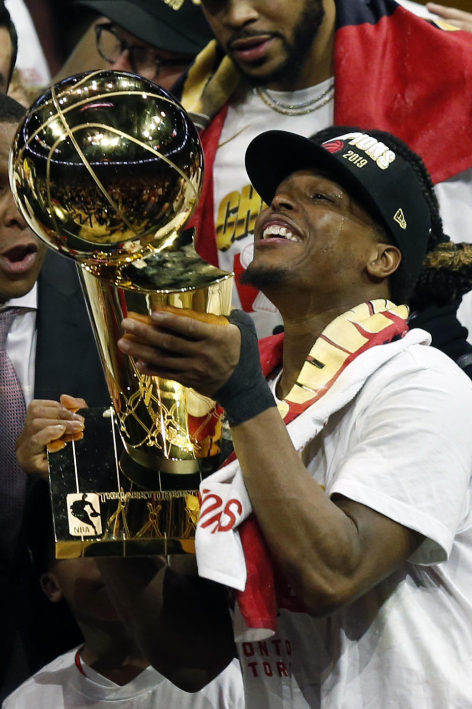 OAKLAND, CALIFORNIA - JUNE 13: Kyle Lowry #7of the Toronto Raptors celebrates with the Larry O'Brien Championship Trophy after his team defeated the Golden State Warriors to win Game Six of the 2019 NBA Finals at ORACLE Arena on June 13, 2019 in Oakland, California. NOTE TO USER: User expressly acknowledges and agrees that, by downloading and or using this photograph, User is consenting to the terms and conditions of the Getty Images License Agreement. (Photo by Lachlan Cunningham/Getty Images)