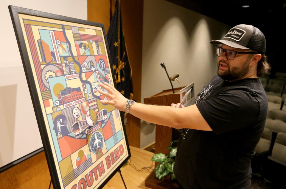 Tyler Foley of South Bend, winner of the “South Bend — The Next 100 Years” poster contest, discusses his winning entry. Whittled down from 10 finalists, the first, second and third place winners were announced in a ceremony Monday, Aug. 28, 2023, in the auditorium at The History Museum and Studebaker National Museum in South Bend.