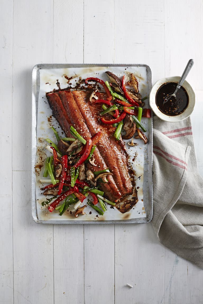 <p>Need a new way to enjoy an old favorite? This honey-soy glazed salmon pairs perfectly with roasted mushrooms and peppers.</p><p><strong><a href="https://www.countryliving.com/food-drinks/recipes/a6126/honey-soy-glazed-salmon-mushrooms-peppers-recipe-clx1214/" rel="nofollow noopener" target="_blank" data-ylk="slk:Get the recipe;elm:context_link;itc:0;sec:content-canvas" class="link ">Get the recipe</a>.</strong></p><p><a class="link " href="https://www.amazon.com/Nordic-Ware-Natural-Aluminum-Commercial/dp/B0049C2S32/?tag=syn-yahoo-20&ascsubtag=%5Bartid%7C10063.g.35055779%5Bsrc%7Cyahoo-us" rel="nofollow noopener" target="_blank" data-ylk="slk:SHOP BAKING SHEETS;elm:context_link;itc:0;sec:content-canvas">SHOP BAKING SHEETS</a> </p>