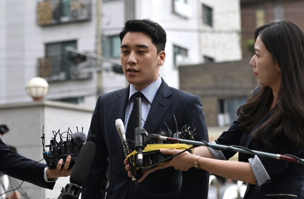 Former BIGBANG member Seungri, real name Lee Seung-hyun, speaks to the media as he arrives for police questioning in Seoul August 28, 2019. — AFP pic