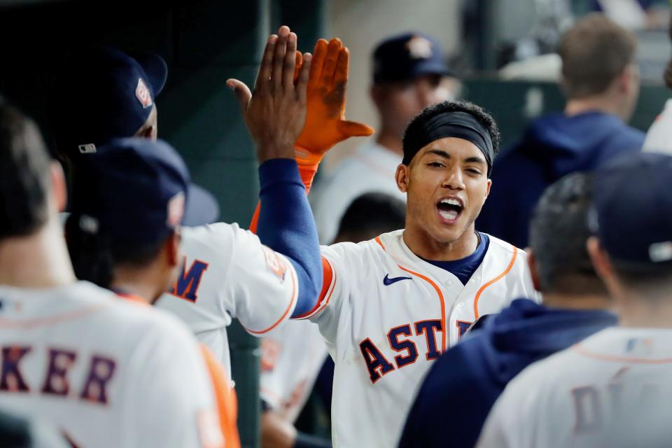 The Astros' Jeremy Pena is congratulated by teammates in the dugout after he hit a home run against the Detroit Tigers on May 5.