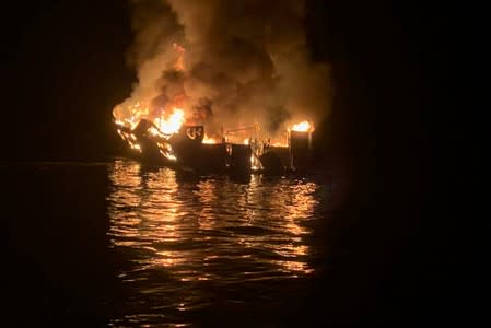 A 75-foot (23-meter) vessel burns during a rescue operation off Santa Cruz Island