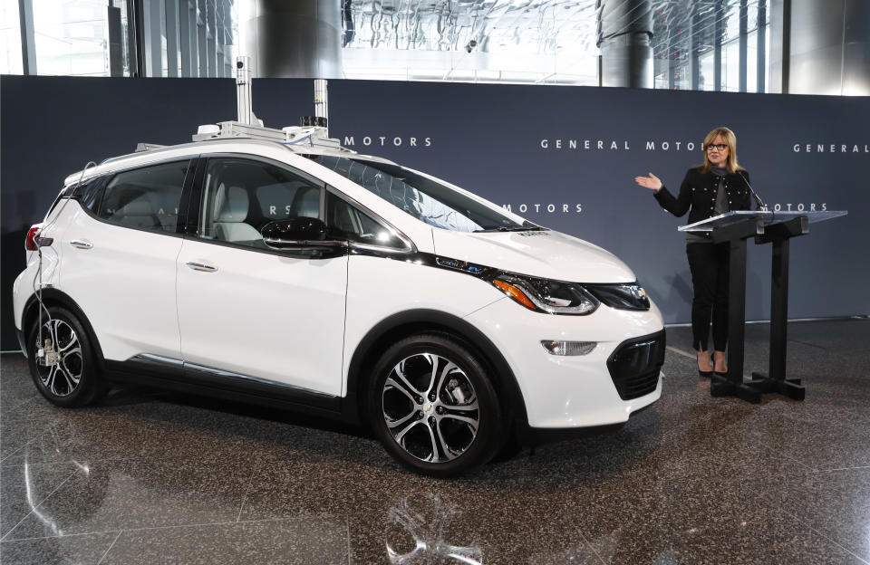 General Motors Chairman and Chief Executive Officer Mary Barra speaks next to a autonomous Chevrolet Bolt electric car Thursday, Dec. 15, 2016, in Detroit. General Motors has started testing fully autonomous vehicles on public roads around its technical center in suburban Detroit. (AP Photo/Paul Sancya)