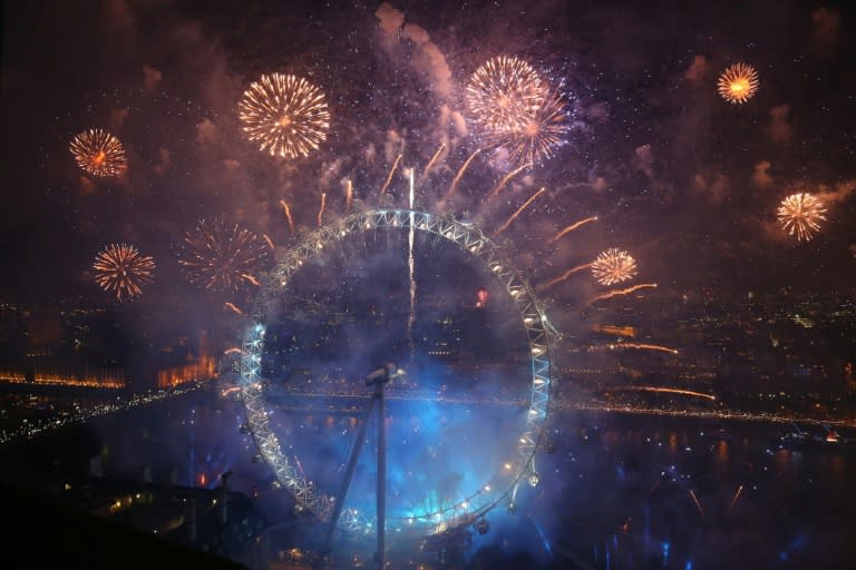 Fireworks explode around the London Eye during New Year's celebrations on January 1, 2016