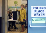 Scottish First Minister Nicola Sturgeon casts her vote in Glasgow, Scotland, Thursday, Dec. 12, 2019. U.K. voters are voting Thursday for who they want to resolve the stalemate over Brexit in a parliamentary election widely seen as one of the most decisive in modern times. (AP Photo/Scott Heppell)