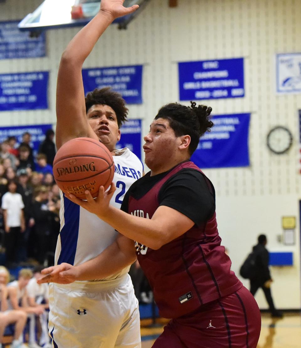 Elmira's Chris Woodard drives to the hoop as Horseheads' Maddox Hughey defends during the Express' 54-49 win in boys basketball Jan. 13, 2023 at Horseheads Middle School.