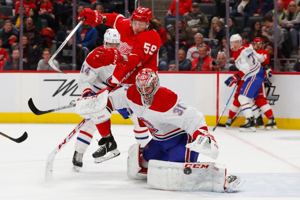 Montreal Canadiens goaltender Carey Price (31) deflects a shot as Detroit Red Wings left wing Tyler Bertuzzi (59) moves for the rebound during the second period on Feb. 18, 2020, in Detroit.
