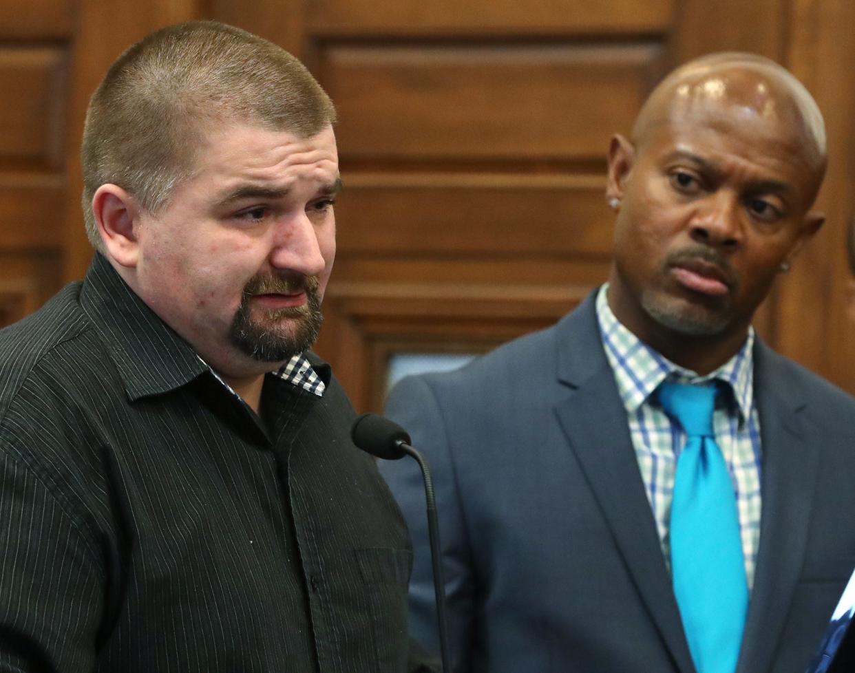 William Huston, left, addresses the court before his sentencing for involuntary manslaughter in the death of his 6-year-old son, Logan, as his defense attorney Job Perry listens Thursday in Summit County Common Pleas Court.