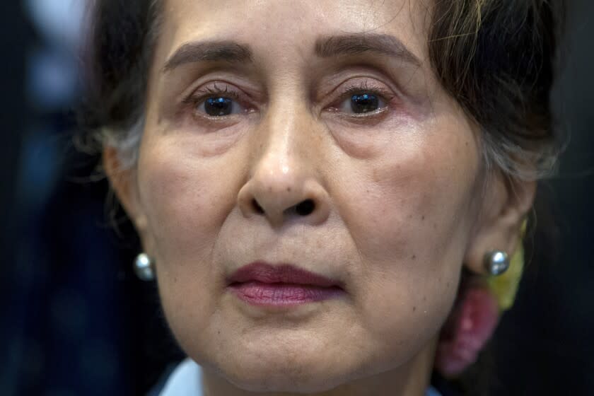 FILE - In this Dec. 11, 2019, file photo, Myanmar's leader Aung San Suu Kyi waits to address judges of the International Court of Justice in The Hague, Netherlands. Myanmar's Anti-Corruption Commission has found that ousted national leader Aung San Suu Kyi had accepted bribes and misused her authority to gain advantageous terms in real estate deals, government-controlled media in the military-ruled country reported Thursday, June 10, 2021. (AP Photo/Peter Dejong, File)