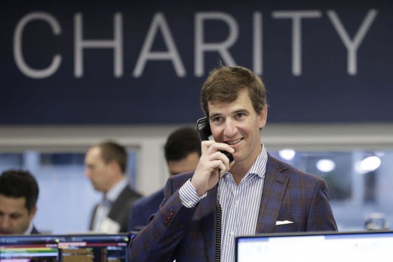 New York Giants quarterback Eli Manning speaks to a client at the 2023 BTIG Commissions for Charity Day in New York City. File Photo by John Angelillo/UPI