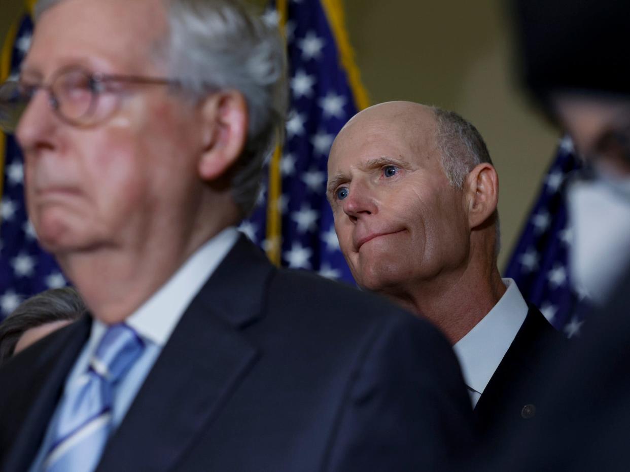 Republican Sen. Rick Scott of Florida (back R) and Senate Minority Leader Mitch McConnell (front L) listen during a news conference after a policy luncheon with Senate Republicans at the US Capitol on September 7, 2022 in Washington, DC.