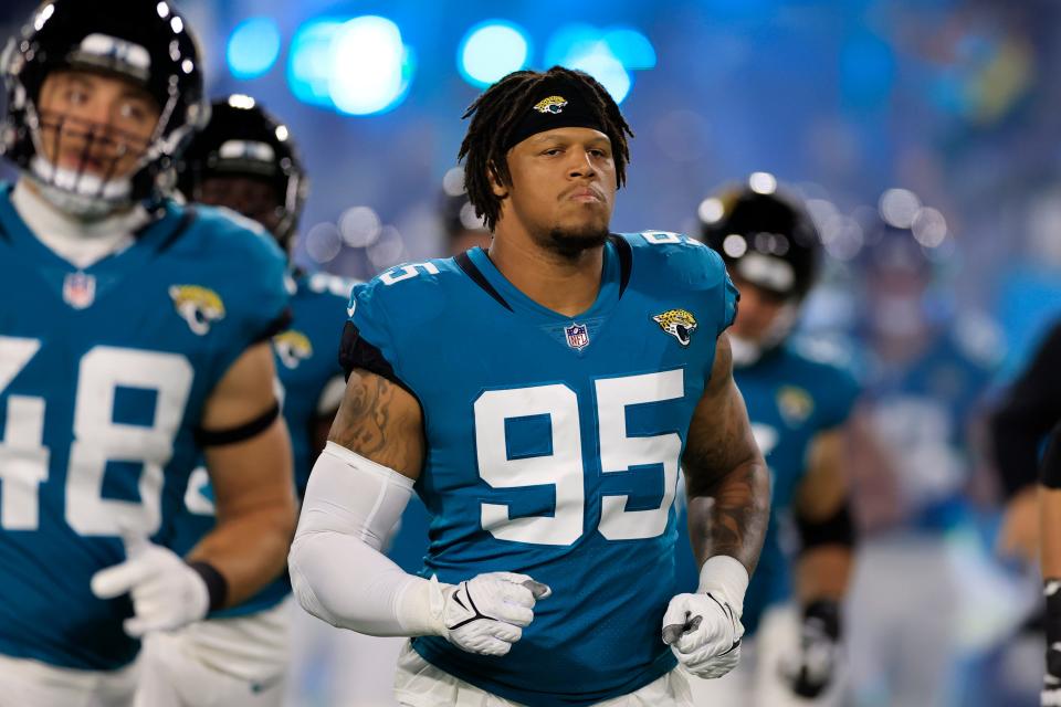 Jacksonville Jaguars defensive end Roy Robertson-Harris (95) runs onto the field before the game of an NFL first round playoff football matchup Saturday, Jan. 14, 2023 at TIAA Bank Field in Jacksonville, Fla. The Jacksonville Jaguars edged the Los Angeles Chargers on a field goal 31-30. [Corey Perrine/Florida Times-Union]