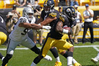Pittsburgh Steelers running back Najee Harris (22) carries the ball past Las Vegas Raiders defensive end Solomon Thomas (92), with guard Kendrick Green (53) providing a block during the first half of an NFL football game in Pittsburgh, Sunday, Sept. 19, 2021. (AP Photo/Keith Srakocic)