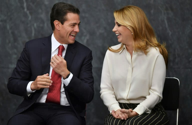 Enrique Peña Nieto speaks with his wife Angelica Rivera after his speech during the presentation of the FIFA World Cup