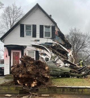 A fallen tree caused significant damage to this Franklin Street home in Weymouth on Monday, Dec./pp18, 2023.