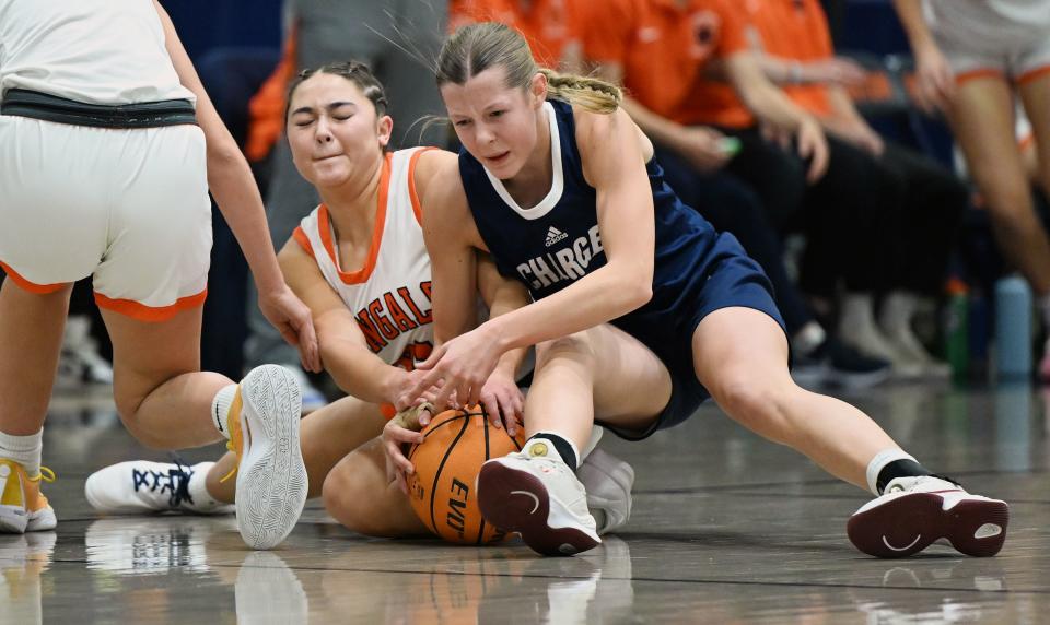 Brighton’s Lucy Chin and Corner Canyon’s Addi Yeomans wrestle for the ball as they play at Brighton in Cottonwood Heights on Wednesday, Dec. 6, 2023. Brighton won 54-51.