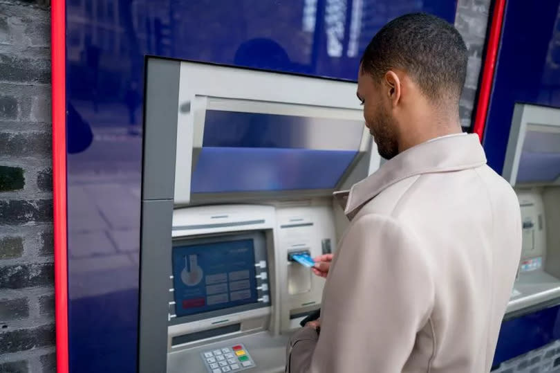 A man at an ATM