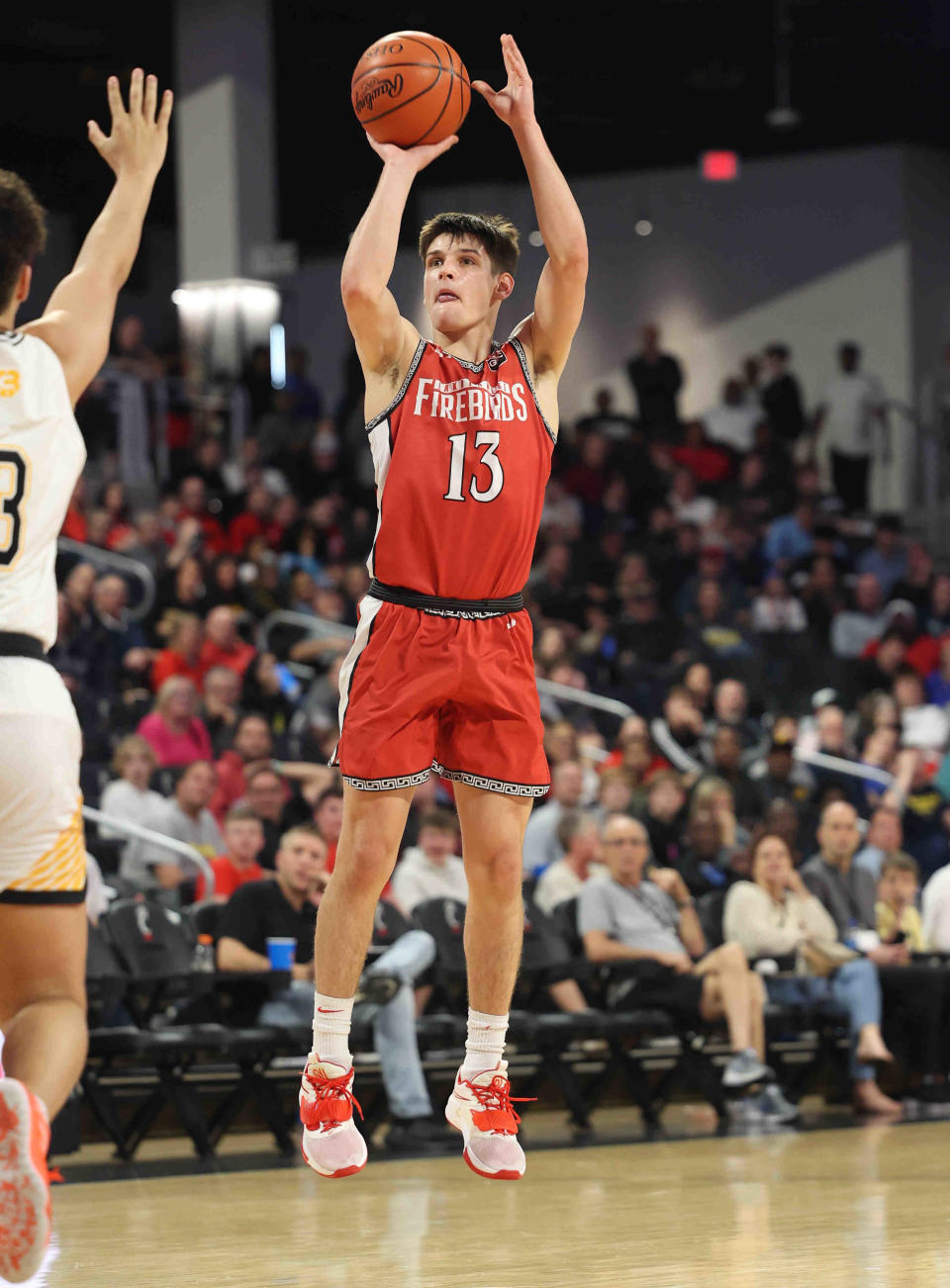 Lakota West guard Nathan Dudukovich (13) shoots the ball during their district final against Centerville, Sunday, March 6. He'll lead the Firebirds in 2022-23.