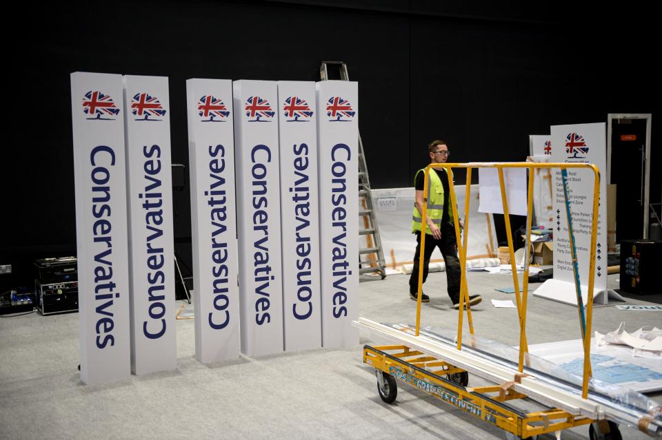 Workers help prepare Conservative Party branding inside Manchester Central convention centre, the venue of the annual Conservative Party conference, in Manchester, northwest England on September 28, 2019 on the eve of the start of the conference. - Embattled British Prime Minister Boris Johnson gathers his Conservative party Sunday for what could be its final conference before an election, and is set to be dominated by fighting talk on Brexit. (Photo by OLI SCARFF / AFP)        (Photo credit should read OLI SCARFF/AFP/Getty Images)