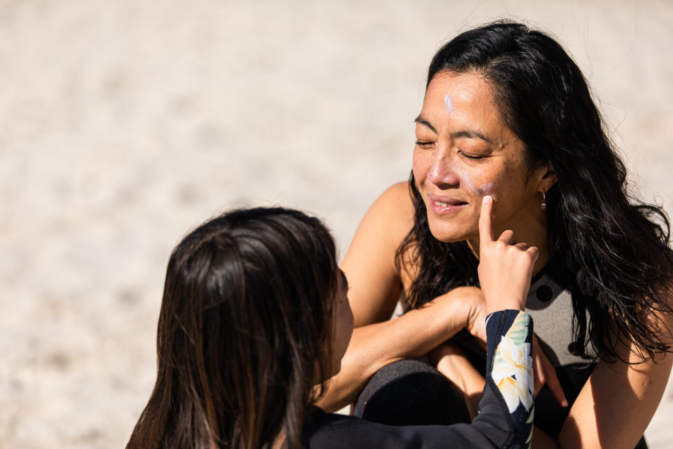 Real life Australian Japanese family gets ready to go surfing together