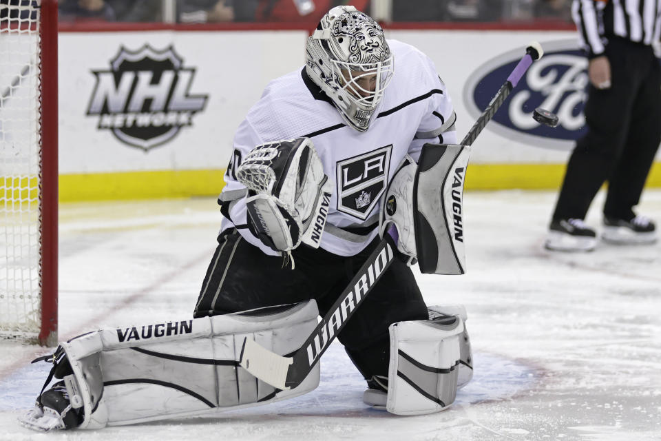 Los Angeles Kings goaltender Cal Petersen makes a save against the New Jersey Devils during the second period of an NHL hockey game Sunday, Jan. 23, 2022, in Newark, N.J. (AP Photo/Adam Hunger)