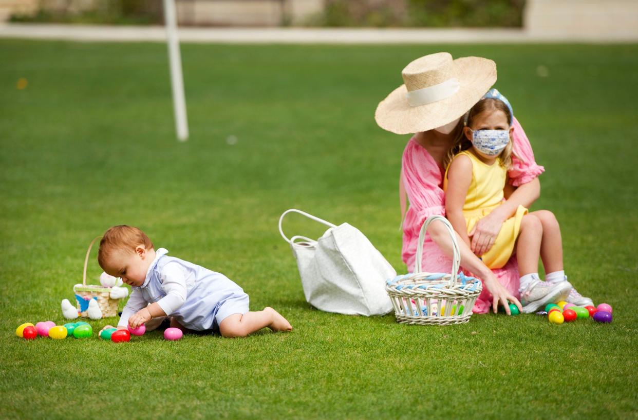 Teddy Clifford, 10 months, and Alexandra and Charlotte Neville, 4, of Palm Beach, take stock of their eggs in April 2021 during the Palm Beach Recreation Department’s annual Spring Celebration.