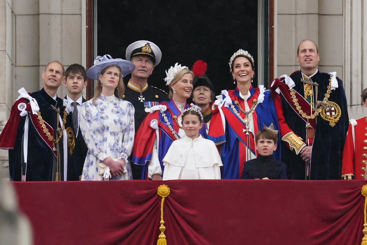 (Left to right) the Duke of Edinburgh, Earl of Wessex, Lady Louise Windsor, Vice Admiral Sir Tim Laurence, Duchess of Edinburgh, Princess Royal, Princess Charlotte, Princess of Wales, Prince Louis and Prince of Wales on the balcony of Buckingham Palace during the flypast (PA)