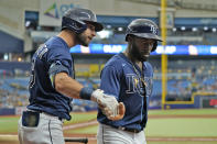 Tampa Bay Rays' Randy Arozarena, right, celebrates with Kevin Kiermaier after Arozarena scored on a sacrifice fly by Joey Wendle during the third inning of a baseball game Wednesday, Aug. 4, 2021, in St. Petersburg, Fla. (AP Photo/Chris O'Meara)