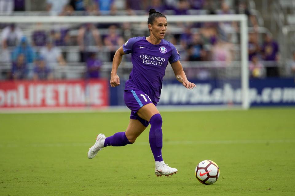 Ali Krieger pushes the ball for the Orlando Pride.