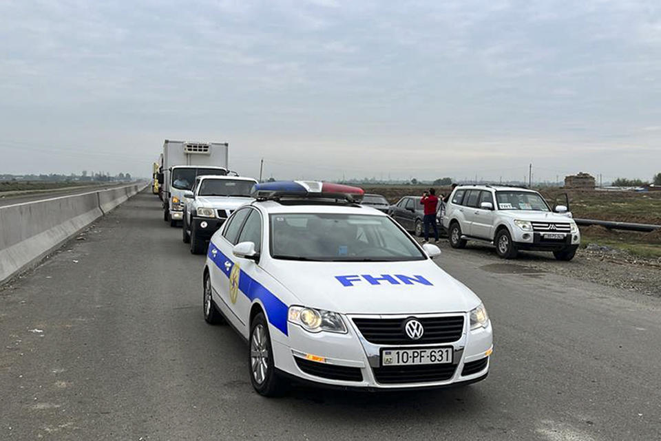 In this photo released by the Ministry of Emergency Situations of the Republic of Azerbaijan on Friday, Sept. 22, 2023, the convoy of the Azerbaijani Ministry of Emergency Situations with humanitarian aid drive to Nagorno-Karabakh, which has been cut off from supplies since late last year. (Ministry of Emergency Situations of the Republic of Azerbaijan via AP)