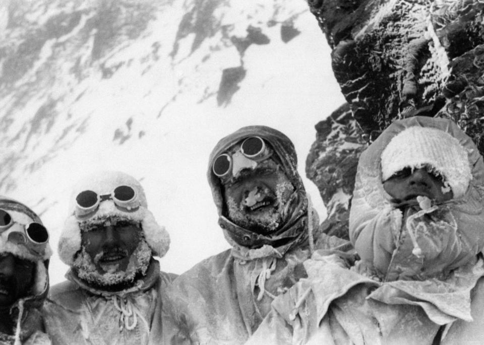 <span class="article__caption">Four members of the expedition for the conquest of K2, covered in their anoraks, smile to the photographs; from right, they’re Sergio Viotto, Lino Lacedelli and Ubaldo Rey. K2 (Pakistan), 1st August 1954. (Photo: Mondadori Portfolio by Getty Images)</span>