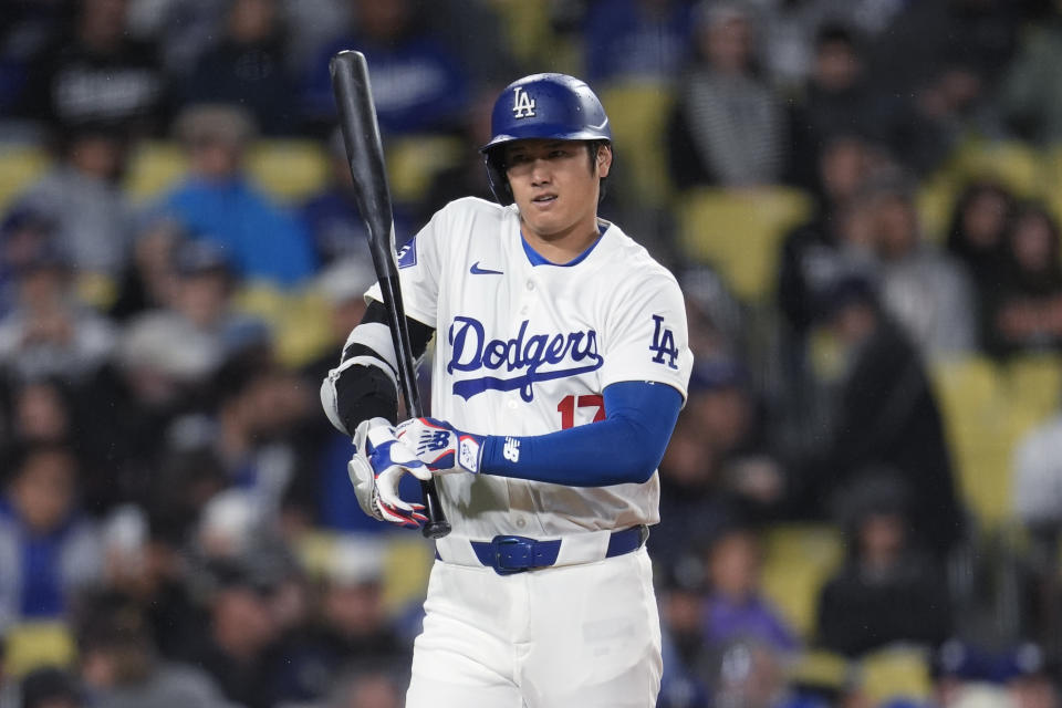 Los Angeles Dodgers' Shohei Ohtani walks up to bat during the first inning of the team's baseball game against the San Diego Padres, Saturday, April 13, 2024, in Los Angeles. (AP Photo/Marcio Jose Sanchez)