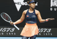 Japan's Naomi Osaka gestures during her match against Russia's Anastasia Pavlyuchenkova at the Australian Open tennis championship in Melbourne, Australia, Monday, Feb. 8, 2021.(AP Photo/Rick Rycroft)