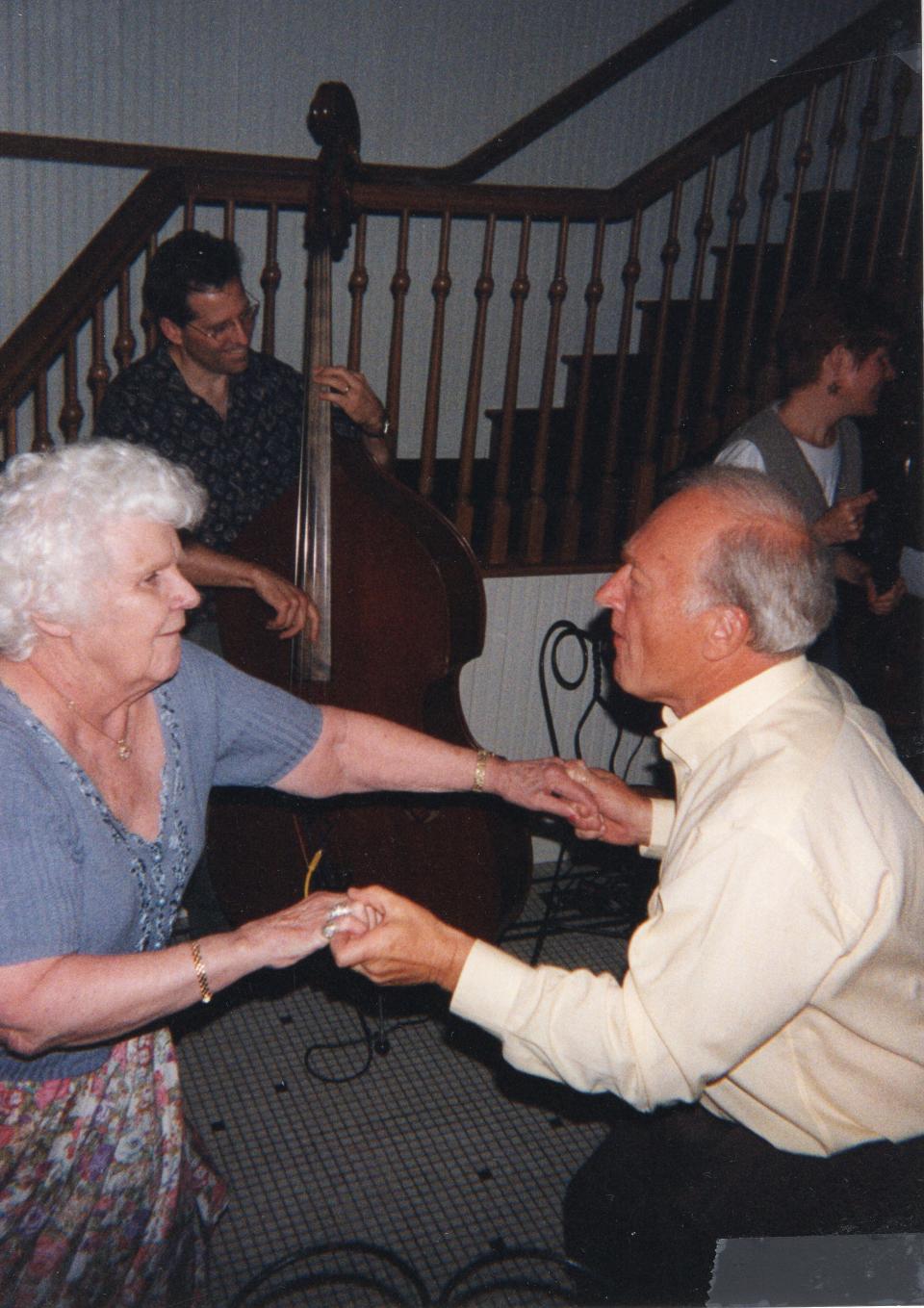 Walt Dear cuts a rug with Marty Branaman at Planter’s Coffee House while musicians Michael and Cari Grey perform in the background sometime in the 1990s. The fun-loving and unbashful Dear loved to entertain.