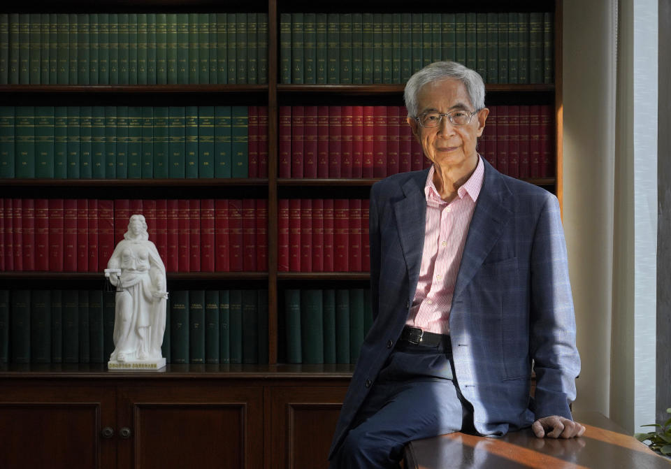Pro-democracy lawyer Martin Lee posts before an interview in Hong Kong, Friday, June 19, 2020. Lee said Friday that Beijing was trying to wrest control of Hong Kong with the impending national security law, and urged people to protest peacefully without violence. (AP Photo/Vincent Yu)