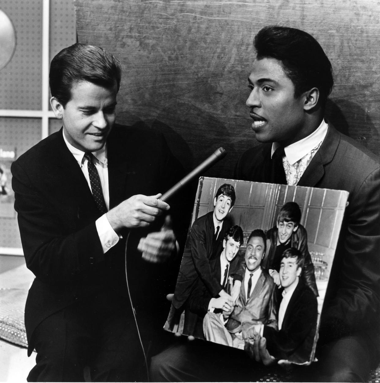 UNITED STATES - JULY 24:  AMERICAN BANDSTAND - Dick Clark - 7/24/64, Dick Clark (left, with guest Little Richard holding a picture of the Beatles) hosted 