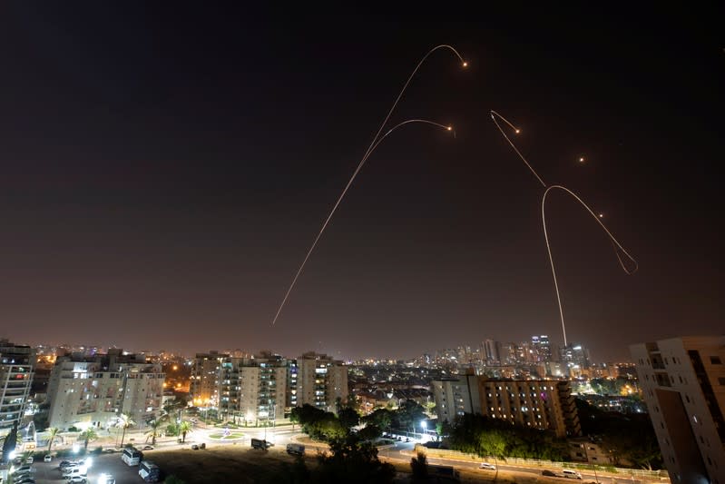 Iron Dome anti-missile system fires interception missiles as rockets are launched from Gaza towards Israel, as seen from the city of Ashkelon