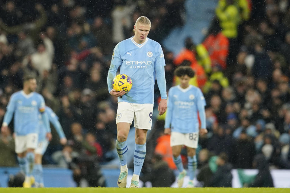 Manchester City's Erling Haaland reacts after Tottenham's Dejan Kulusevski scored their third goal during the English Premier League soccer match between Manchester City and Tottenham Hotspur at Etihad stadium in Manchester, England, Sunday, Dec. 3, 2023. (AP Photo/Dave Thompson)
