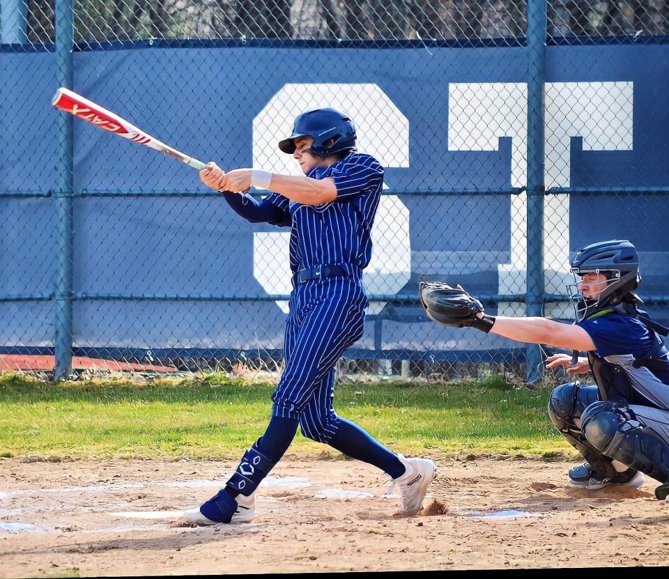 St. Thomas Aquinas sophomore Thaao Papakonstantis take a cut during Wednesday's Division II game against Sanborn. Papakonstantis had two hits and five RBIs in the Saints' 20-6 win.