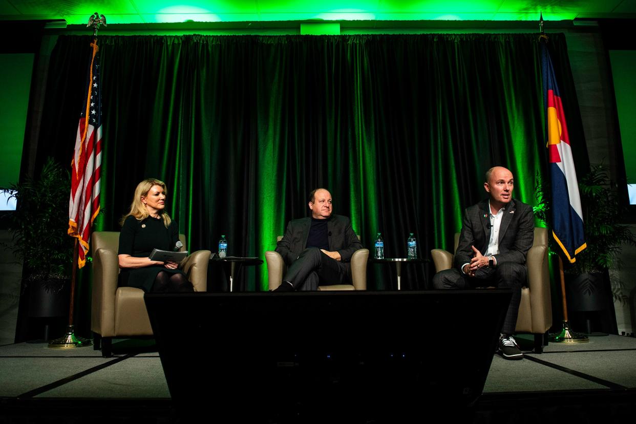 Governors Spencer Cox of Utah and Jared Polis of Colorado discuss a topic during a discussion moderated by CSU President Amy Parsons about how our society can learn to disagree in a way that allows us to find solutions and solve problems. The event was held at Colorado State University in Fort Collins on Wednesday.