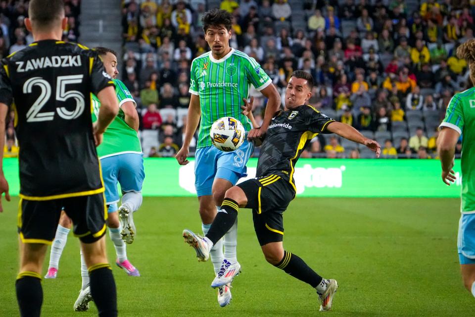 Sep 7, 2024; Columbus, OH, USA; Columbus Crew midfielder Dylan Chambost (7) fights for the ball against Seattle Sounders FC midfielder Josh Atencio (8) in the first half at Lower.com Field.