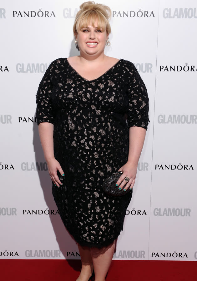 Rebel Wilson looked sophisticated in a Marina Rinaldi dress and box clutch.