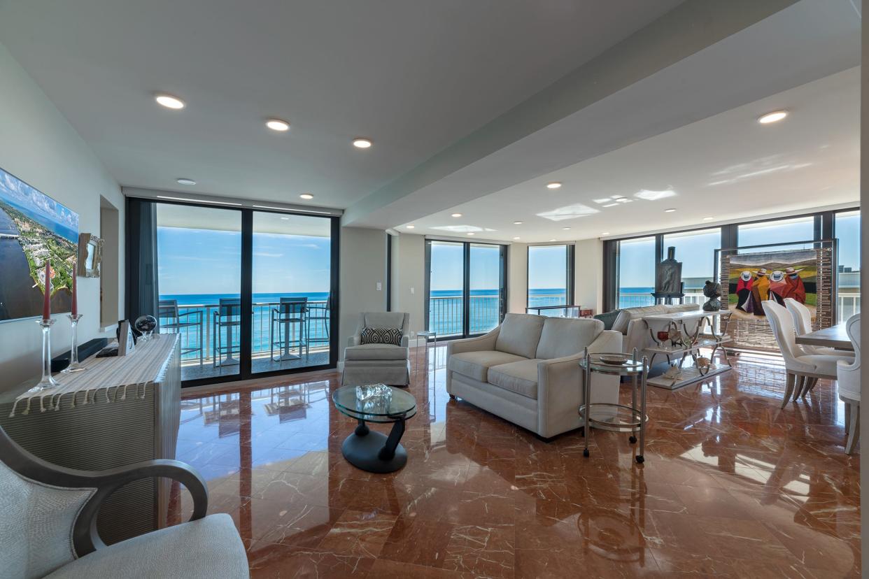 Banks of sliding glass doors in the great room face the sea in a renovated condominium at the Enclave. The three-bedroom apartment is listed for sale at $3.25 million.
