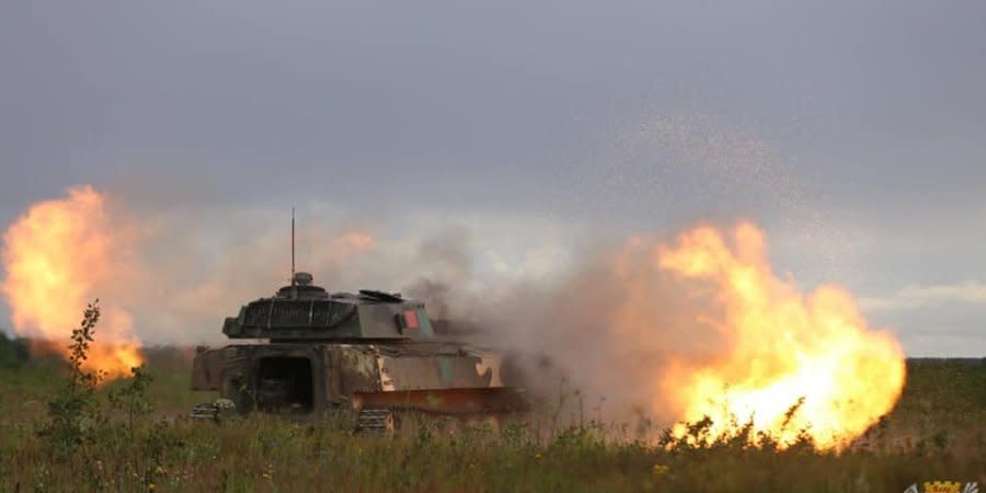 Belarusian artillerymen fire from Gvozdyka self-propelled howitzers during a recent military training