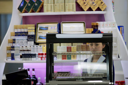 A vendor waits for customers at the shop inside the international airport in Pyongyang, North Korea May 3, 2016. REUTERS/Damir Sagolj