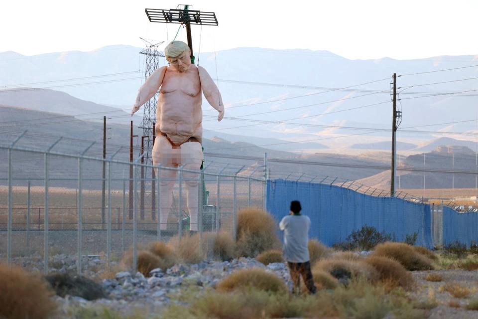 A 43-foot-tall naked statue resembling Donald Trump is displayed in a fenced-in lot near Interstate 15 north of Las Vegas, Nevada, September 28, 2024. (AFP via Getty Images)