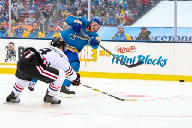 St. Louis Blues' Vladimir Tarasenko, front, of Russia, is congratulated by  teammates after scoring a goal during the third period of the NHL Winter  Classic hockey game against the Chicago Blackhaw …