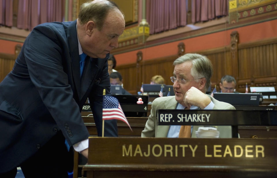 State Rep. Stephen Dargan, D- West Haven, talks with House Majority Leader Rep. Brandan Sharkey D-Hamden, during a special session at the Capitol in Hartford, Conn., Tuesday, June 12, 2012. (AP Photo/Jessica Hill)